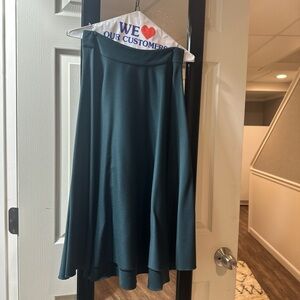 Forest green midi skirt with a zipper on the side.